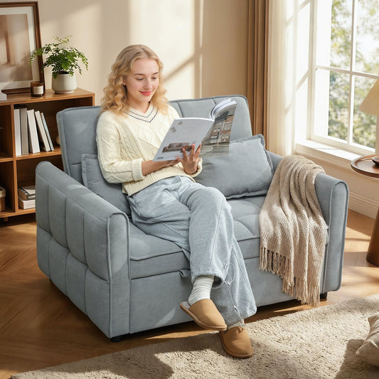 Woman reading a book on the grey sofa bed in a living room setting