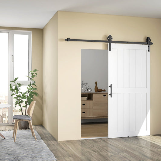 A white sliding barn door kit installed in a modern room with wooden floors and furniture