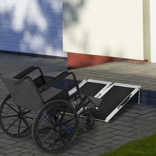 The aluminium duo wheelchair ramp is in use bridging a step for a wheelchair