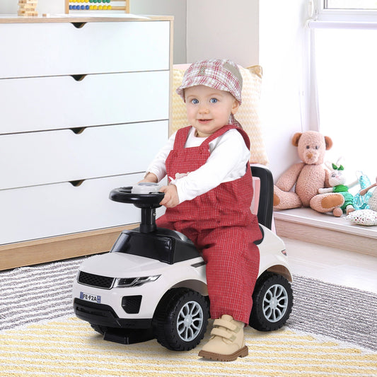 A baby sits on the white ride-on car in a nursery room