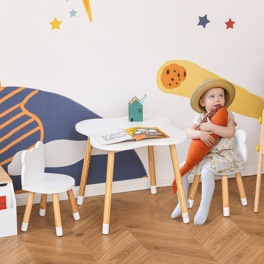 the kids desk set in a nursery with a young child sitting on one chair