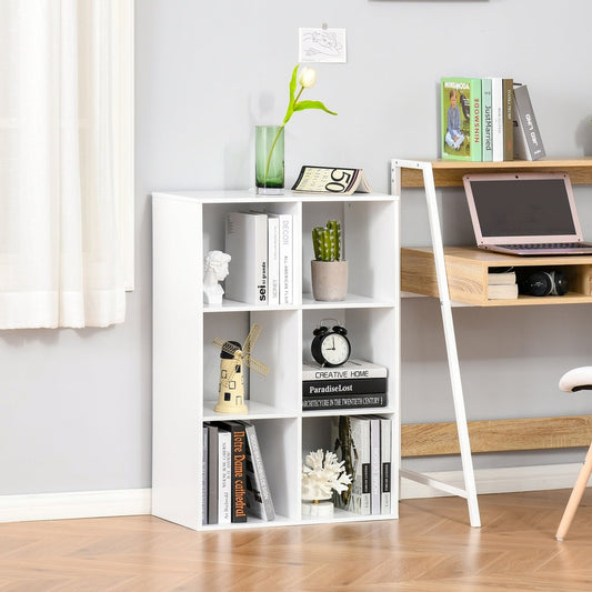The white storage cabinet with six cube compartments, shown in a room with a desk and plant