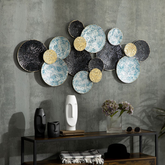 The metal wall art is displayed on a grey wall above a console table with decorative items