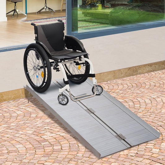 The mobility ramp positioned at a doorway with a wheelchair resting on the surface