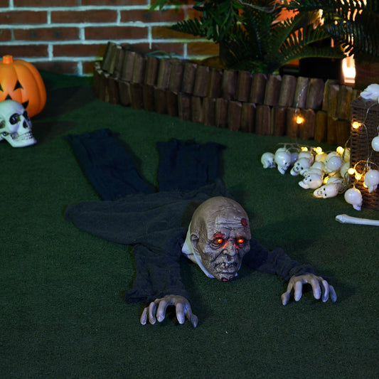 the crawling zombie prop in a garden setting with Halloween decorations