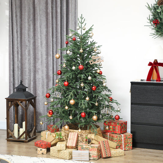 The artificial tree decorated with red and gold baubles in a cosy living room with gift boxes