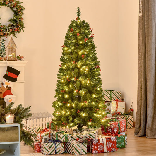 The pre lit Christmas tree decorated with presents in a cosy room setting