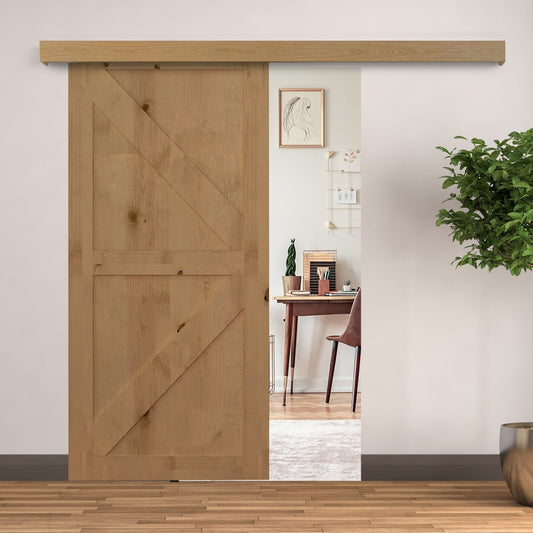 The sliding door hardware installed on a wooden door inside a bright home interior