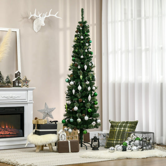 The pencil christmas tree decorated with baubles in a cosy living room by a fireplace
