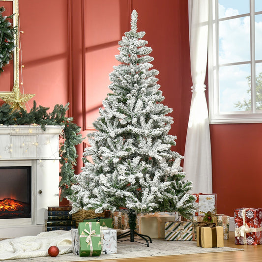 The snow flocked artificial Christmas tree is decorated in a living room with presents underneath