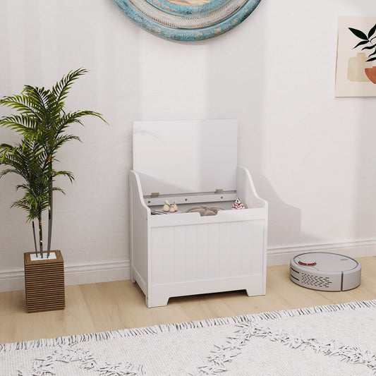 White storage cabinet in a room with a plant and a robot vacuum cleaner