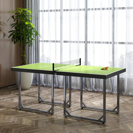 The table tennis table set up in a room with a plant and artwork on the wall