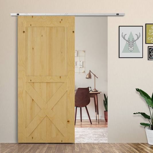 Modern sliding barn door closet hardware track kit installed on a wooden door in a room