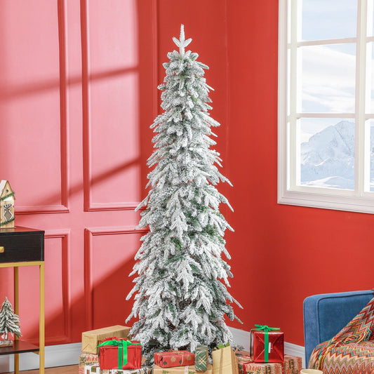The white Christmas tree is decorated with presents and sits in a room with red walls