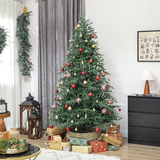 the artificial Christmas tree decorated with baubles and garlands in a living room
