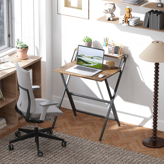 Rustic brown folding computer desk with monitor shelf set up in a home office with a laptop and chair