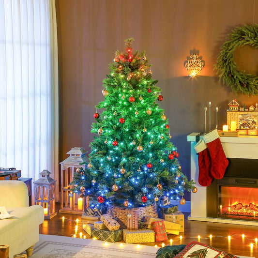 The artificial Christmas tree is decorated with baubles and presents in a cosy room setting
