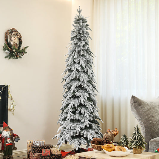 The snow-covered artificial Christmas tree decorated in a living room setting