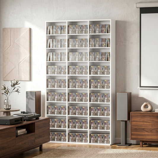 The tall white media storage shelf filled with DVDs and Blu-rays in a living room setting