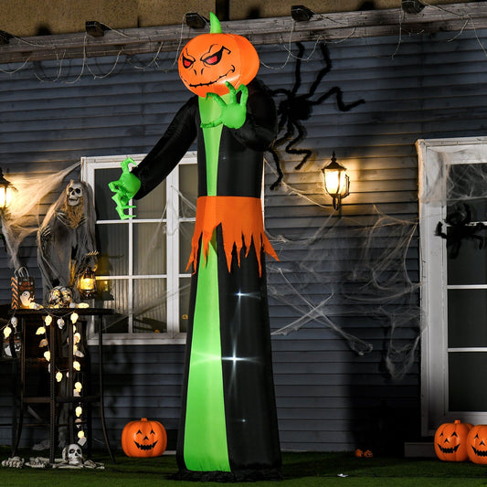 The Halloween inflatable standing on a lawn in front of a house decorated for the spooky season