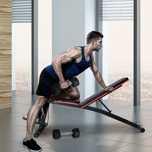Man using the adjustable reclined dumbbell bench for weight lifting at home