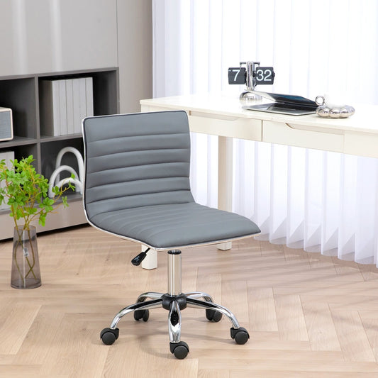 The light grey armless task desk chair in a home office setting next to a desk