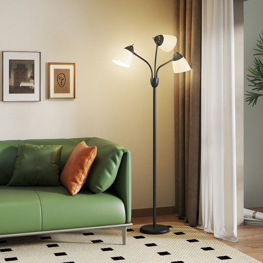 The arc tree floor lamp in a modern living room next to a green sofa