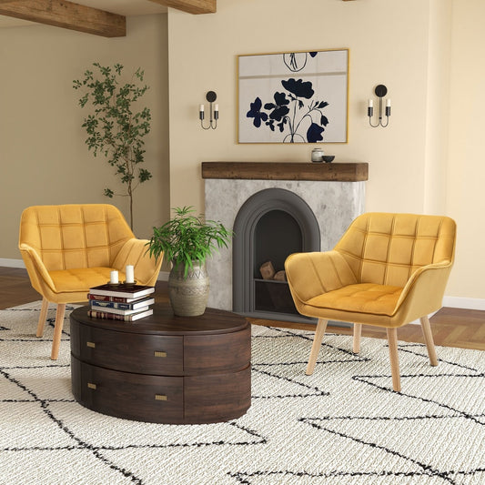 Two yellow accent chairs in a living room setting with a fireplace and rug