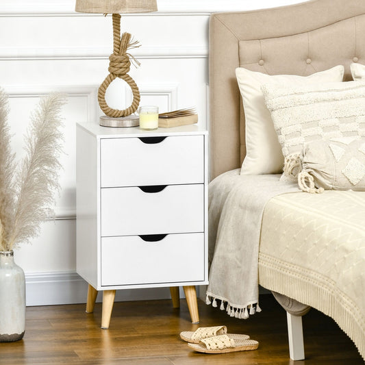 The white chest of drawers with three drawers is next to a bed