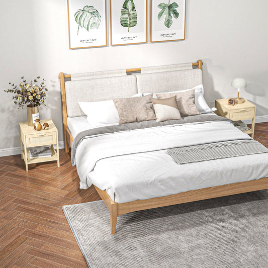 The storage cabinets placed on either side of a double bed in a bright bedroom