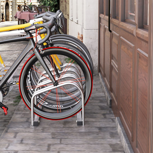 The cycle storage rack holding multiple bicycles on a paved outdoor area