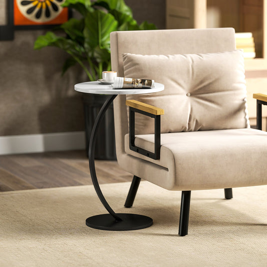 The side table placed next to a beige armchair with a coffee cup and magazine on the surface