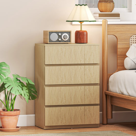 The chest of drawers in a bedroom setting with a lamp and plant on top