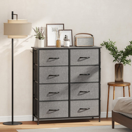 The chest of drawers in a bedroom setting with a lamp and bed
