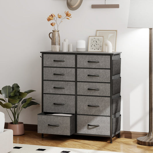 The chest of drawers in a bedroom setting with a plant and decorative items on top