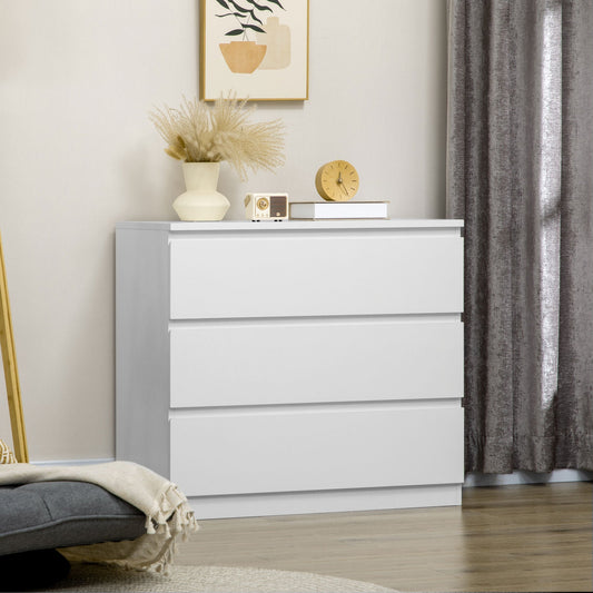 A white three drawer chest of drawers in a bedroom setting with a mirror and vase