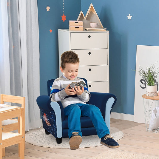 A young boy sitting on the blue kids sofa chair with a space theme in a child's bedroom