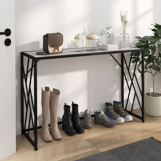 The console table placed in a hallway with shoes, a handbag and decorative items on and under it