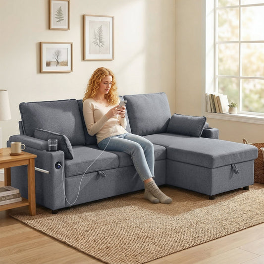 The grey l-shaped sleeper sectional sofa with reversible storage chaise in a living room with a woman sitting on it