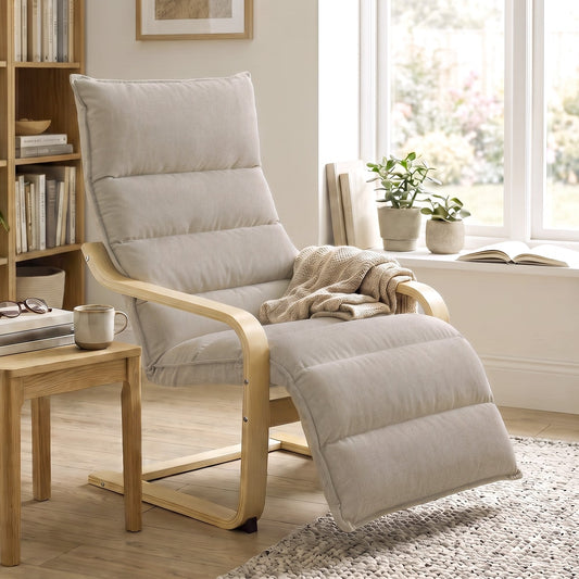 The armchair in a living room setting next to a side table and bookshelf