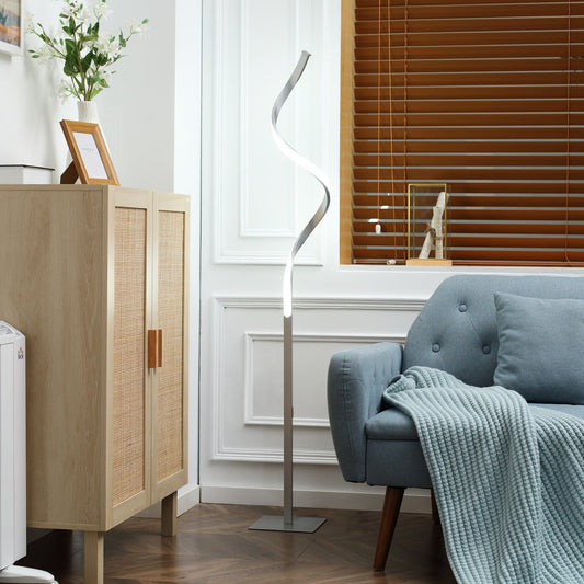 The modern spiral standing lamp in a living room next to a sofa and cabinet