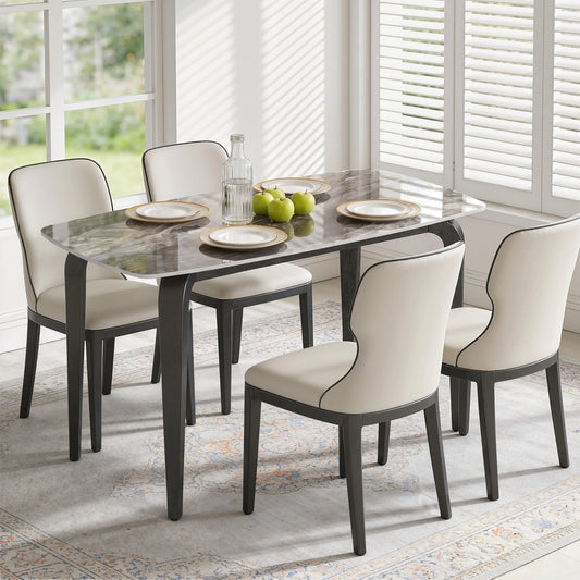 The dining table set up with four chairs in a dining room setting