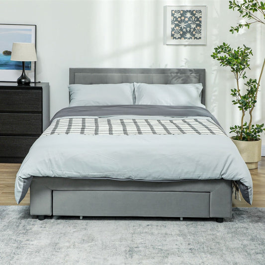 The grey double bed frame with a front drawer, dressed with bedding in a bedroom