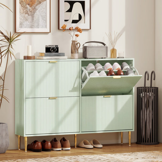 Light green four-drawer shoe storage cabinet in a hallway with shoes inside and on the floor