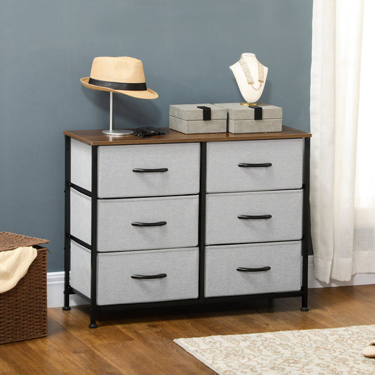 The grey fabric chest of drawers styled in a room with a hat and jewellery box on top