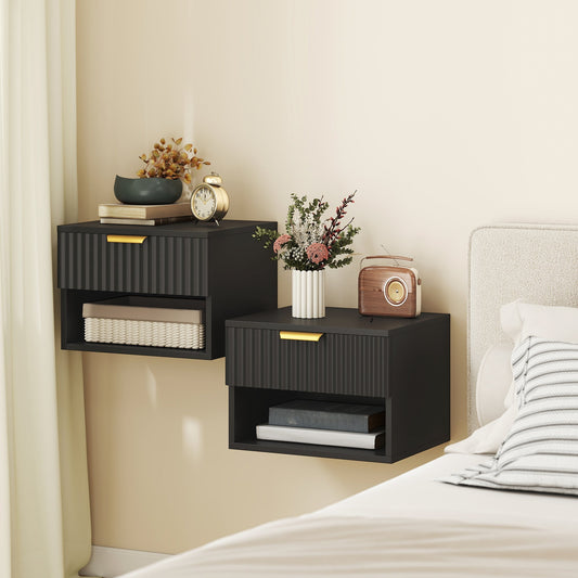Two black wall mounted bedside tables with gold handles in a bedroom setting