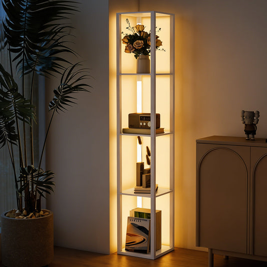 The floor lamp with shelves illuminated in a corner next to a plant and a wooden cabinet