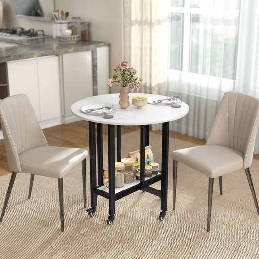 The folding dining table set up in a kitchen with two chairs