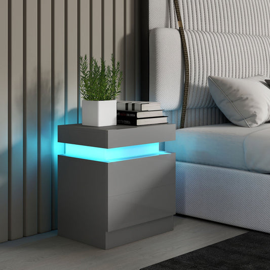 The grey bedside table with LED light shown next to a bed in a bedroom setting