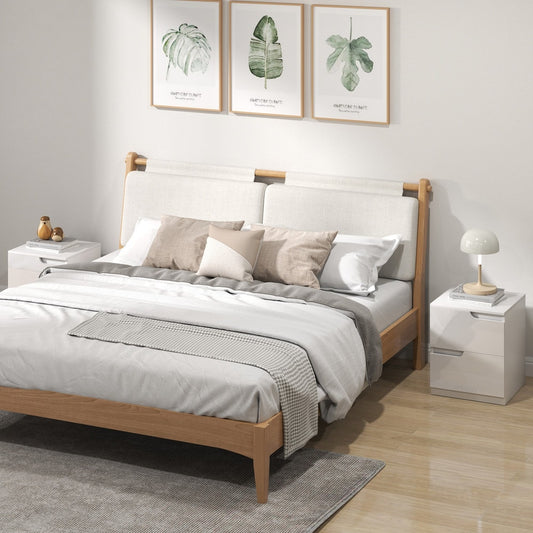 Two white high gloss bedside cabinets in a bedroom setting next to a bed